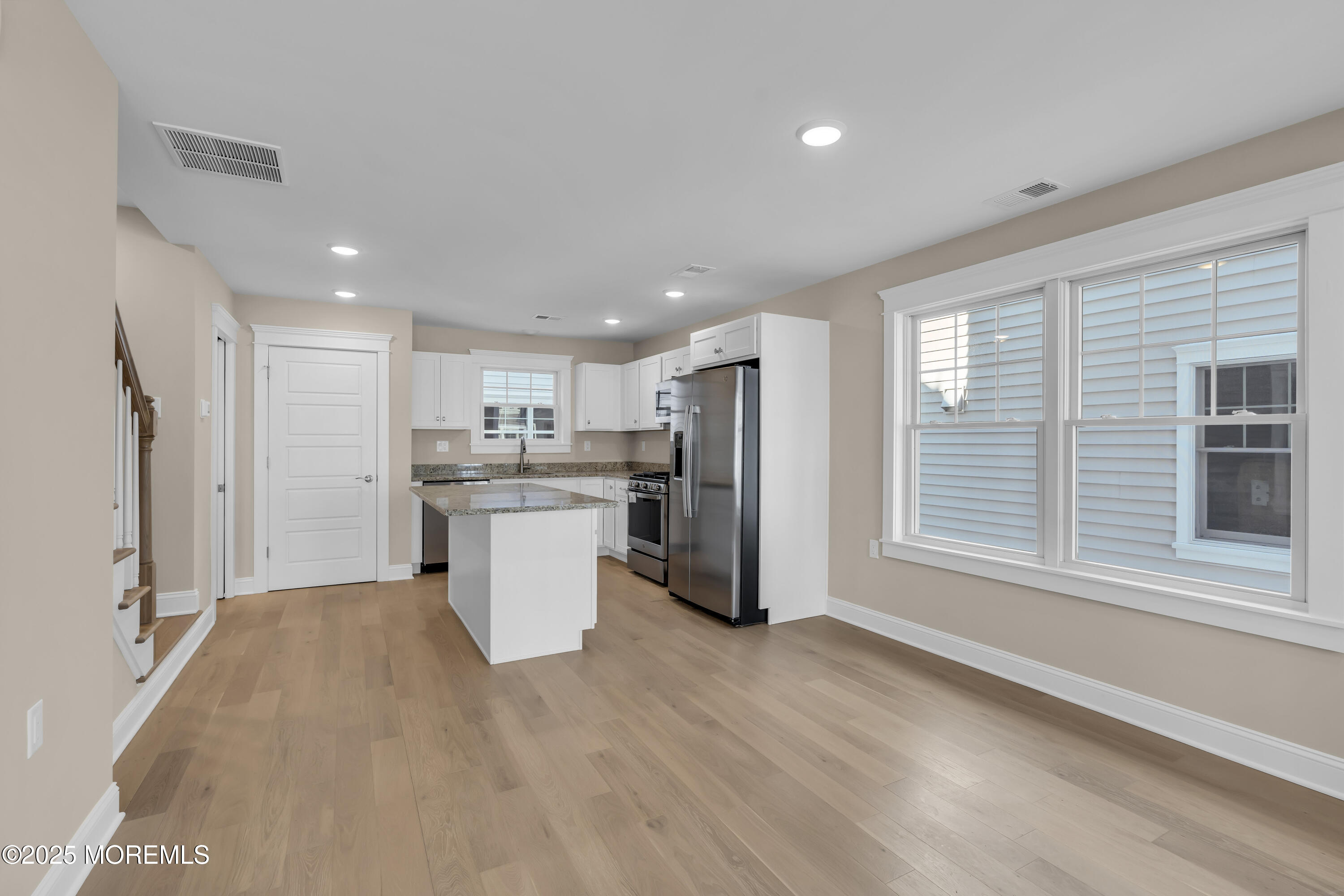 24 Shell Road, Unit 126 Mantoloking, NJ 08738 - Photo 7 of 31 a kitchen with a refrigerator and window
