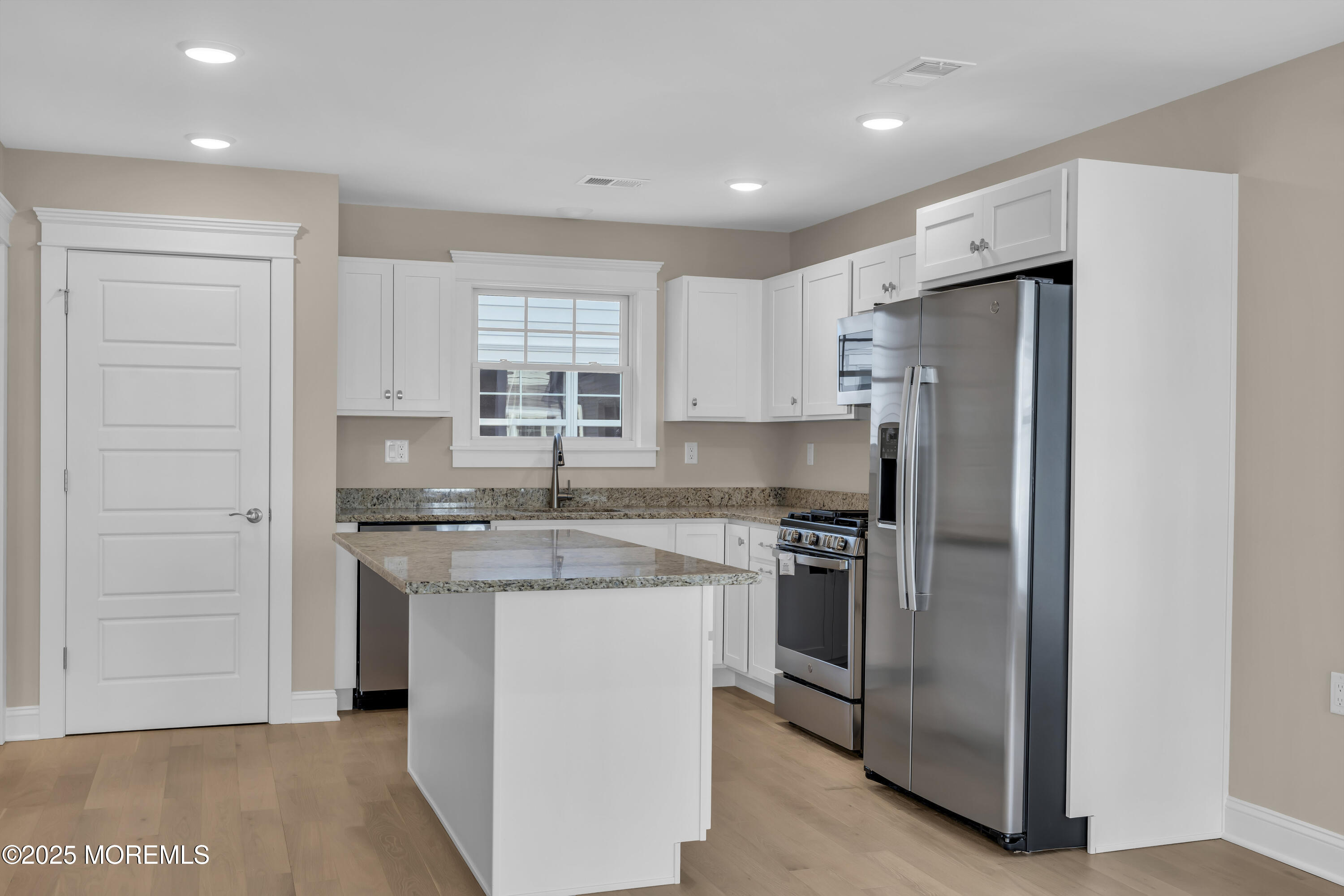 24 Shell Road, Unit 126 Mantoloking, NJ 08738 - Photo 10 of 31 a kitchen with stainless steel appliances granite countertop a refrigerator and a stove top oven