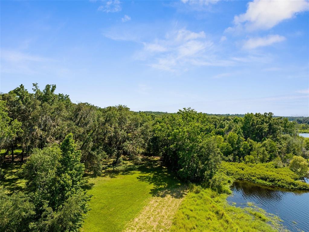 Pumpkin Path Brooksville, FL 34602 - Photo 29 of 33 a view of a lake with a mountain in the background