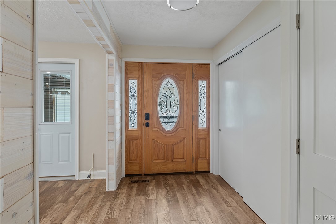 13 East Edgewater Drive Fulton, NY 13069 - Photo 3 of 37 Foyer entry with large closet and door to your att