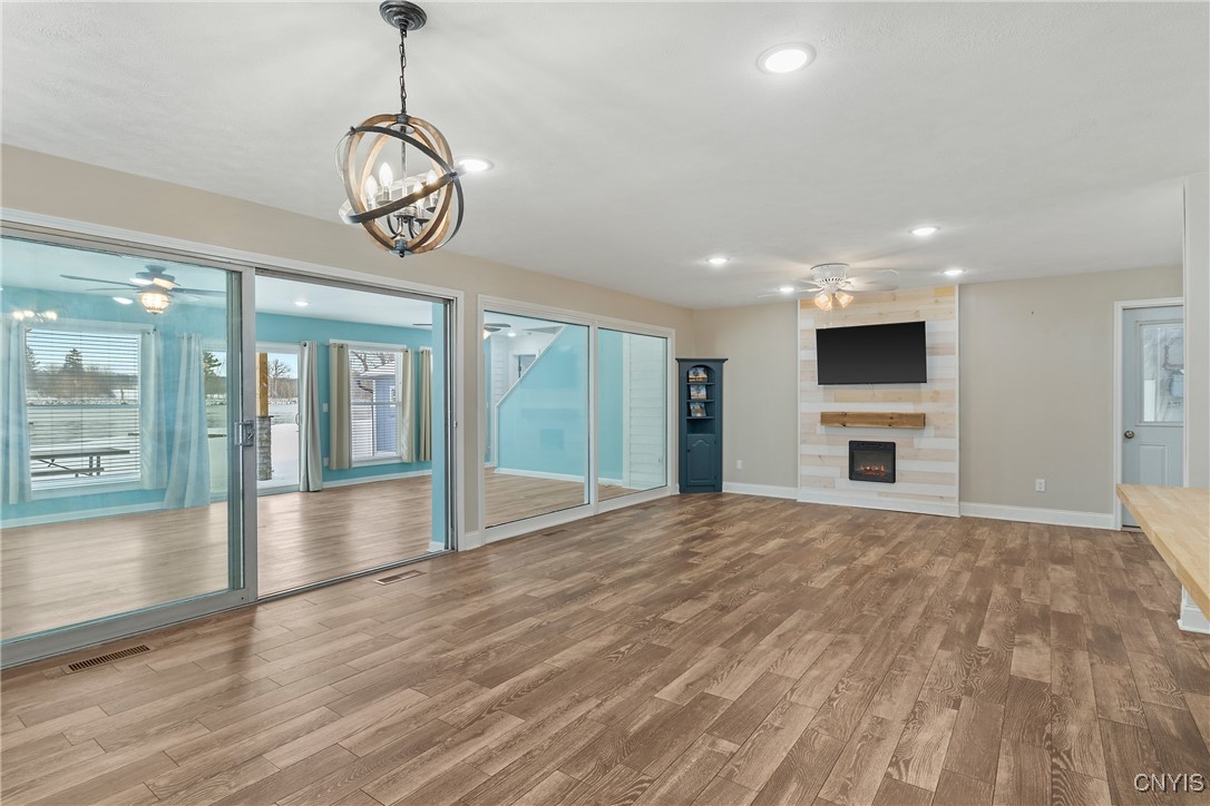 13 East Edgewater Drive Fulton, NY 13069 - Photo 5 of 37 Dining room open to living room with fireplace fea