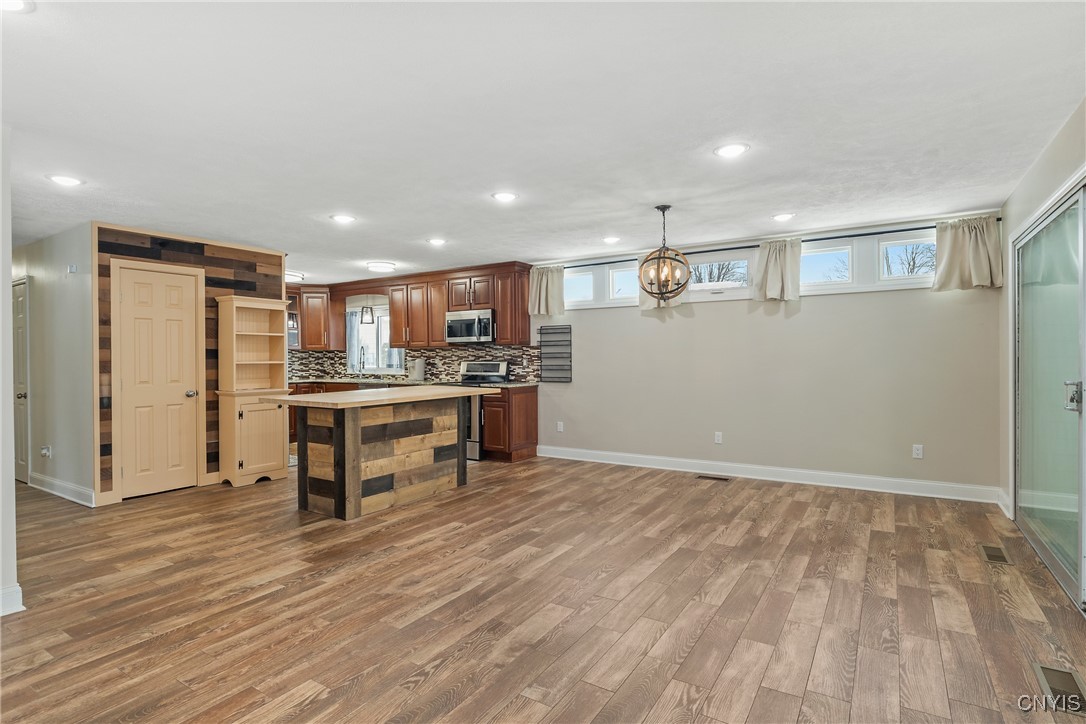 13 East Edgewater Drive Fulton, NY 13069 - Photo 6 of 37 Large dining room open to kitchen