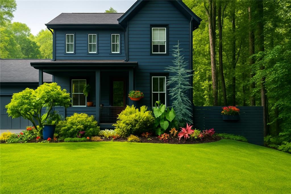 a front view of a house with a garden