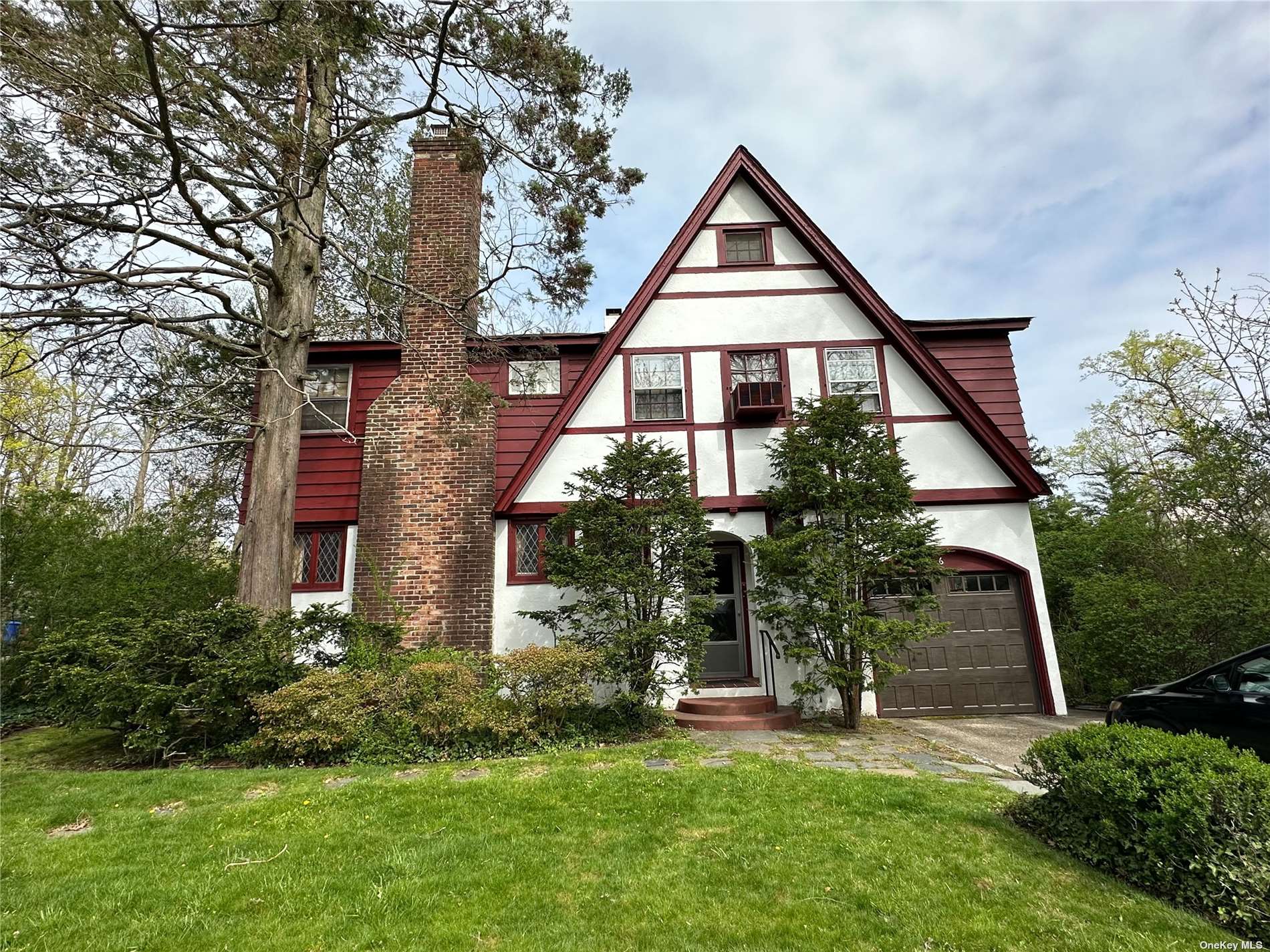 6 Sheffield Road Great Neck, NY 11021 - Photo 1 of 1 a front view of a house with a yard