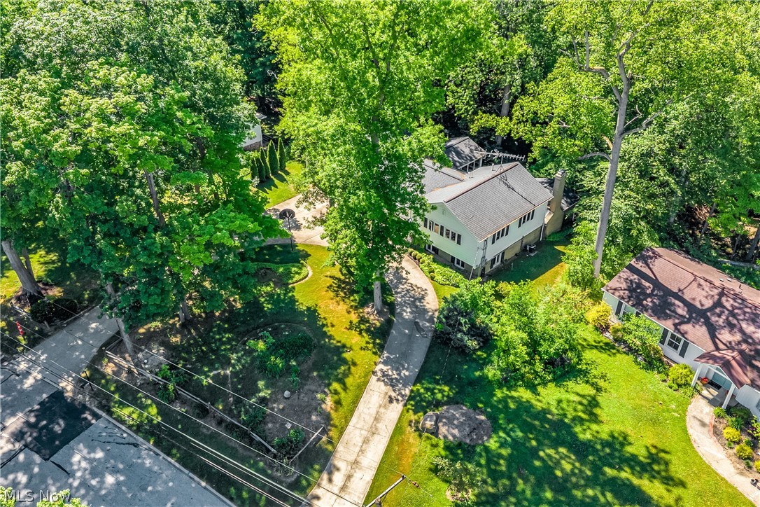 6821 Thornapple Road Gates Mills, OH 44040 - Photo 39 of 42 Aerial perspective showcasing a multi-story residence with a light-colored exterior and dark-toned roof