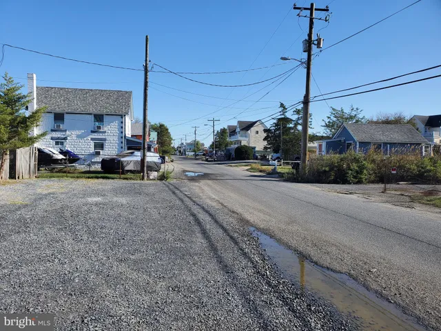 a view of a street with cars