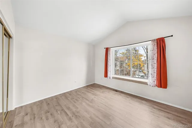 an empty room with large window