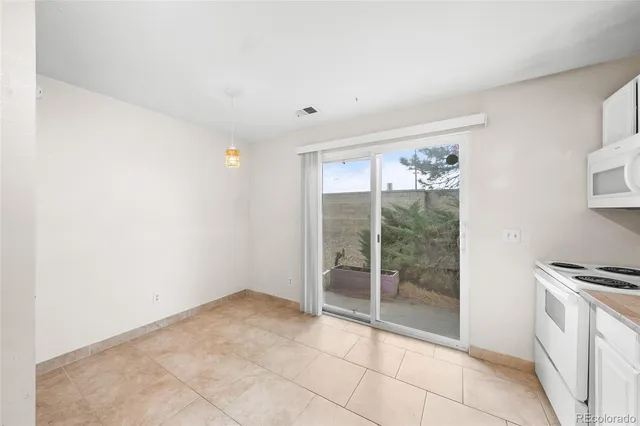 a view of an empty room with a fireplace