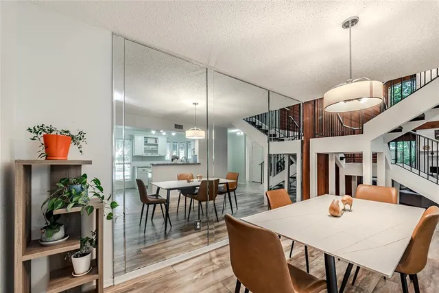 a large kitchen with a table and chairs
