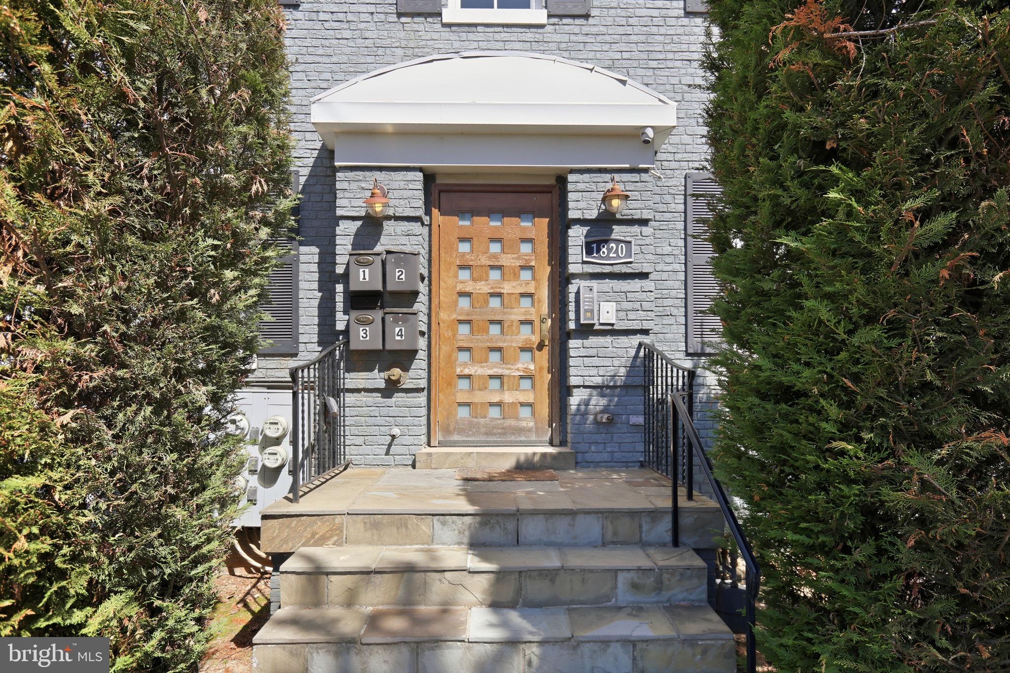 1820 Independence Avenue Southeast, Unit 1 Washington, DC 20003 - Photo 29 of 32 a front view of a house with a garden