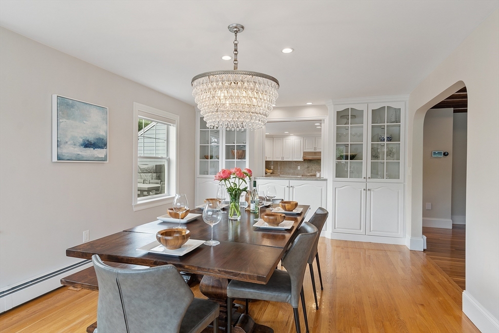 1 Colonial Road Lynnfield, MA 01940 - Photo 13 of 42 a view of a dining room with furniture wooden floor and chandelier
