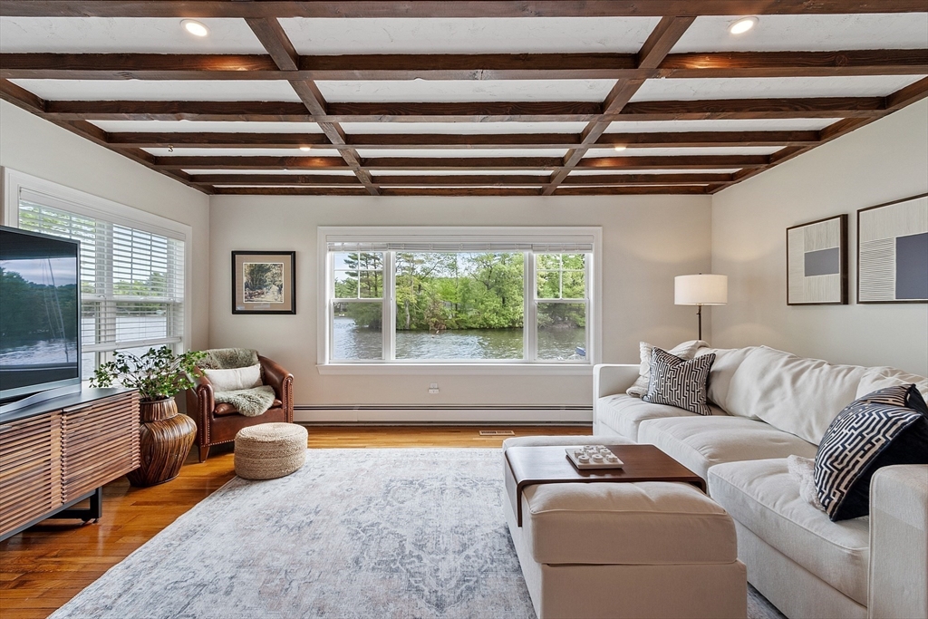1 Colonial Road Lynnfield, MA 01940 - Photo 15 of 42 a living room with furniture and a flat screen tv