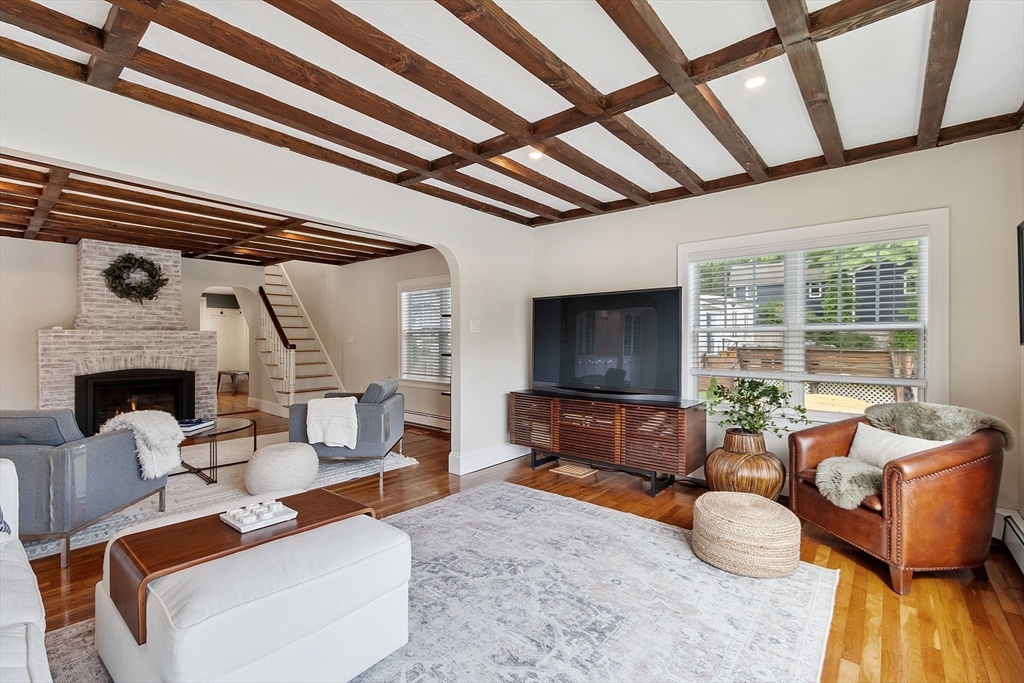 1 Colonial Road Lynnfield, MA 01940 - Photo 17 of 42 a living room with furniture and a flat screen tv