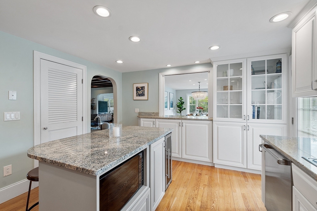 1 Colonial Road Lynnfield, MA 01940 - Photo 19 of 42 a kitchen with kitchen island a counter top space and wooden floor