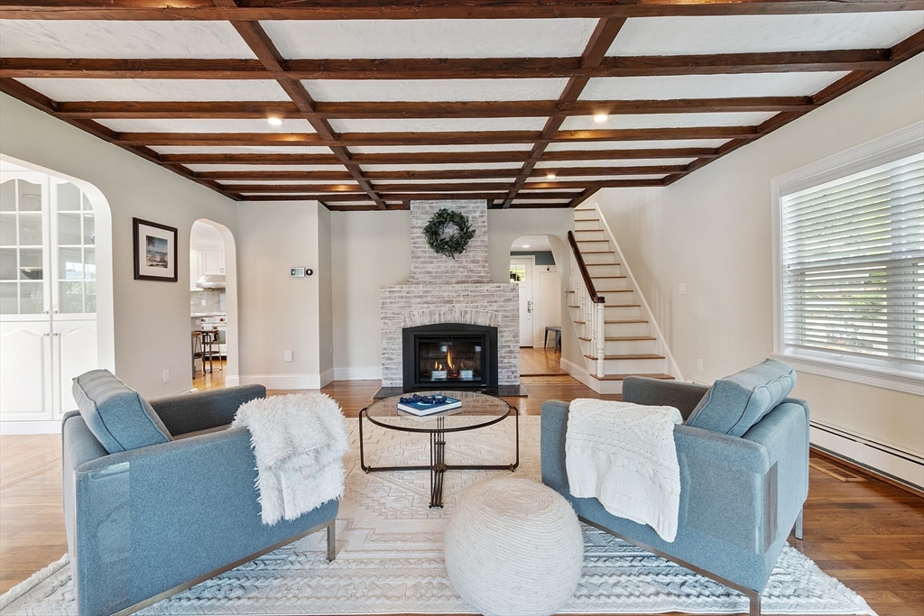 1 Colonial Road Lynnfield, MA 01940 - Photo 20 of 42 a living room with furniture and a fireplace