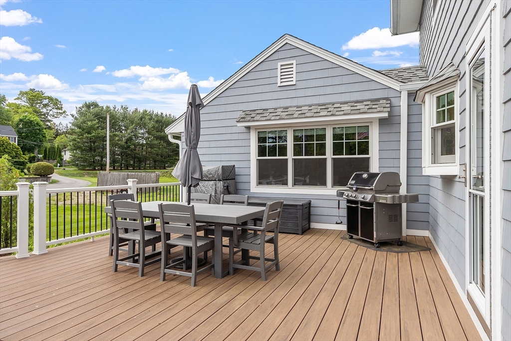 1 Colonial Road Lynnfield, MA 01940 - Photo 31 of 42 a view of a house with dining table and chairs