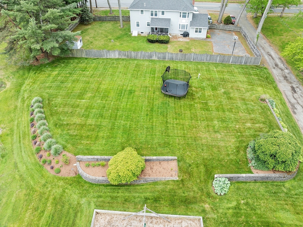 1 Colonial Road Lynnfield, MA 01940 - Photo 34 of 42 a view of a table and chairs in the garden
