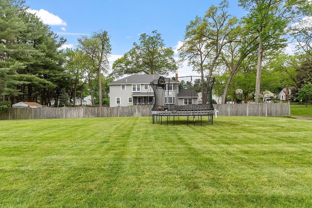 1 Colonial Road Lynnfield, MA 01940 - Photo 36 of 42 a house view with swimming pool and garden space