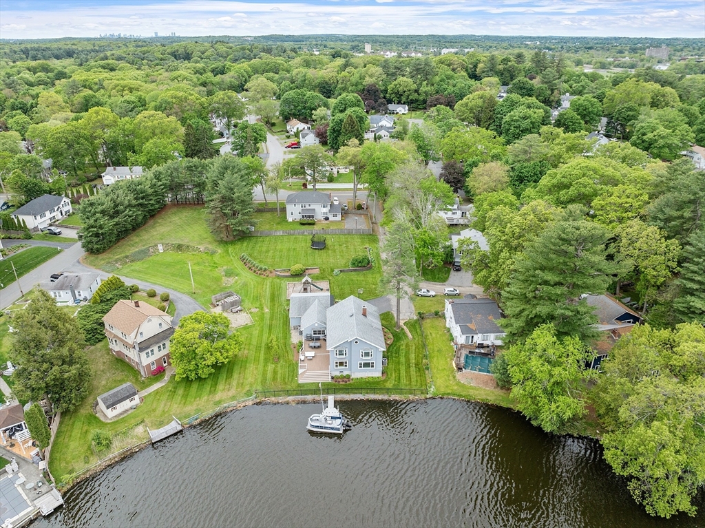 1 Colonial Road Lynnfield, MA 01940 - Photo 7 of 42 an aerial view of a house with a yard and lake view