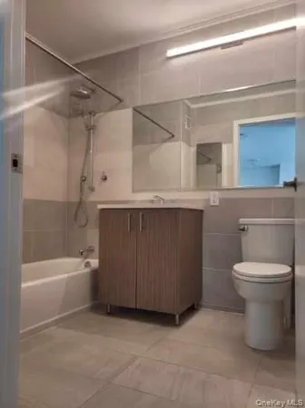 a bathroom with a sink a toilet and bathtub