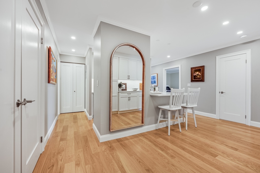 85 East India Row, Unit 34G Boston, MA 02110 - Photo 2 of 20 a view of a livingroom with furniture and wooden floor