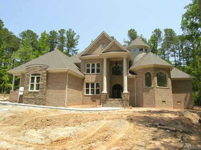 10 Tuscan Lake Raleigh, NC 27613 - Photo 1 of 8 a front view of a house with a yard