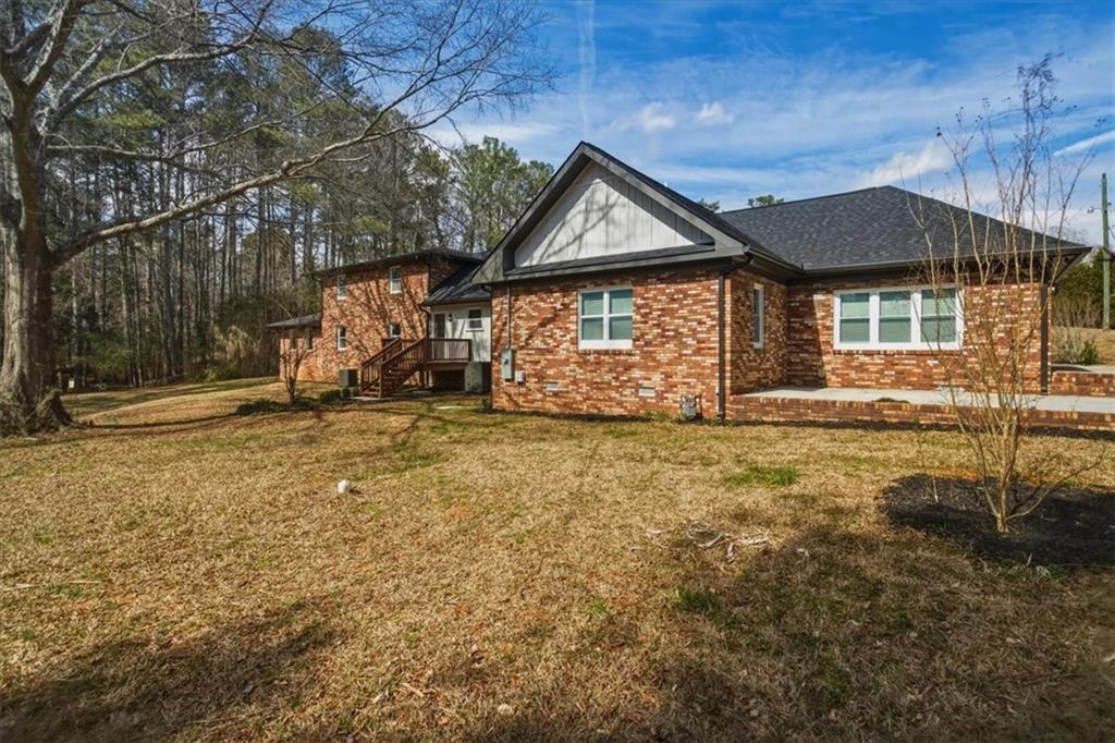 4911 Lower Jersey Road Oxford, GA 30054 - Photo 35 of 56 a front view of a house with a yard