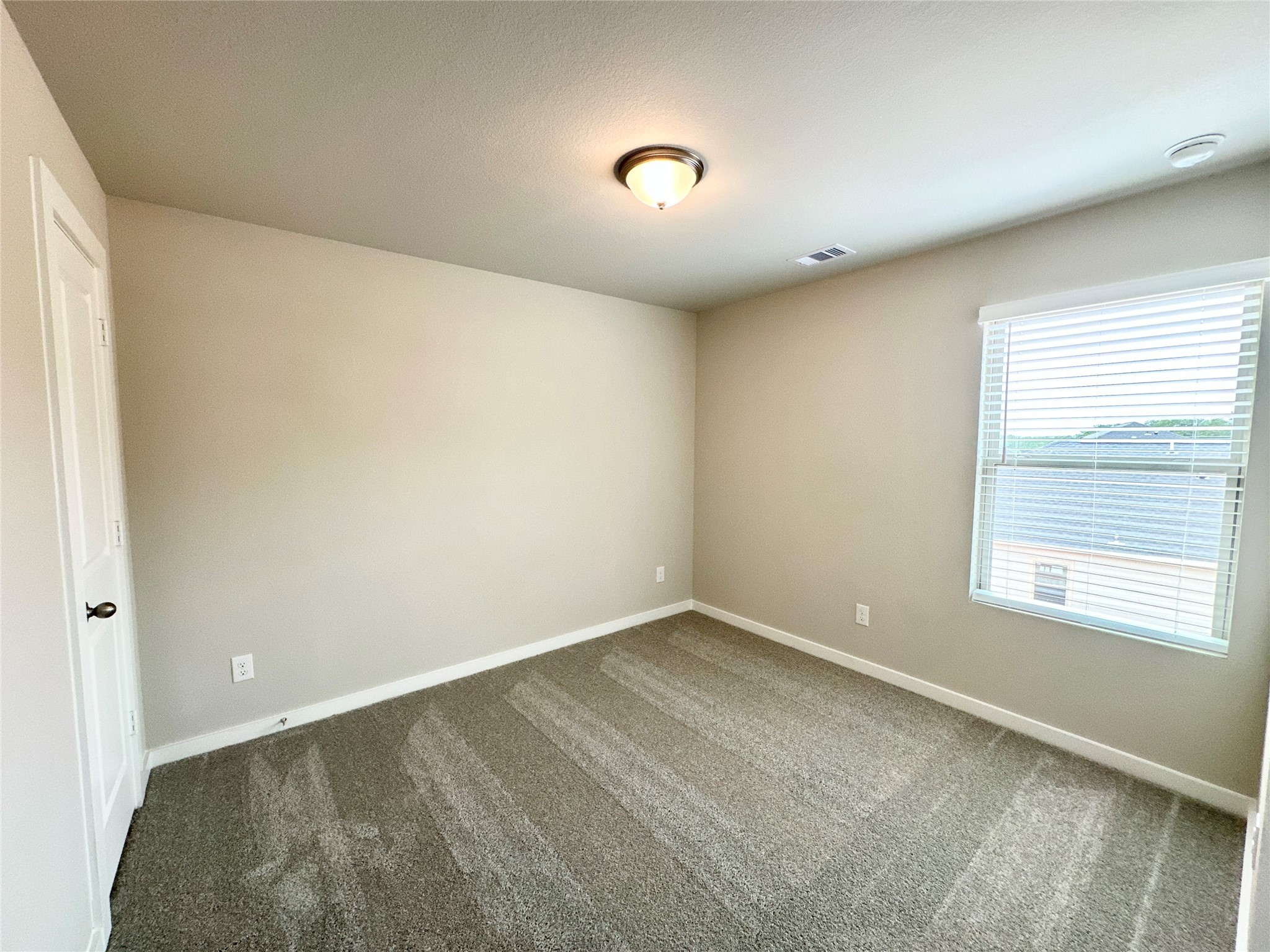 12198 Ridge Top Drive Conroe, TX 77304 - Photo 15 of 27 a view of an empty room with a window