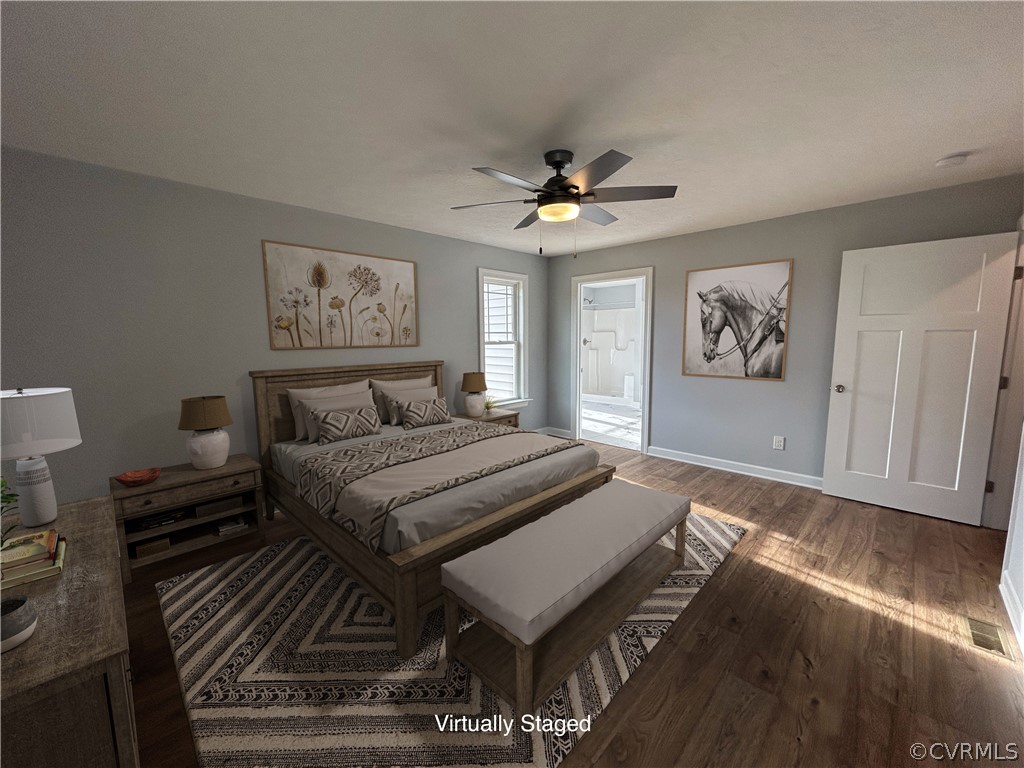 2029 Churchville Road West Point, VA 23181 - Photo 11 of 17 a spacious bedroom with a bed and a chandelier