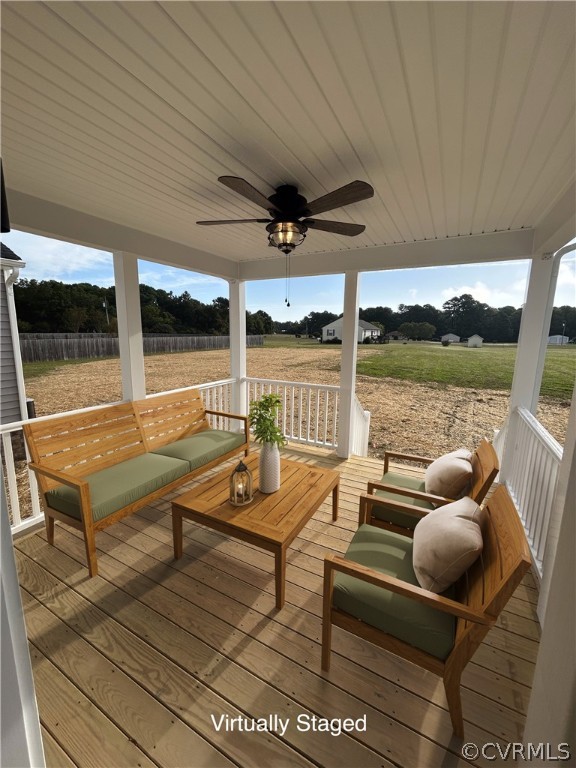2029 Churchville Road West Point, VA 23181 - Photo 17 of 17 a living room with patio furniture and a floor to ceiling window