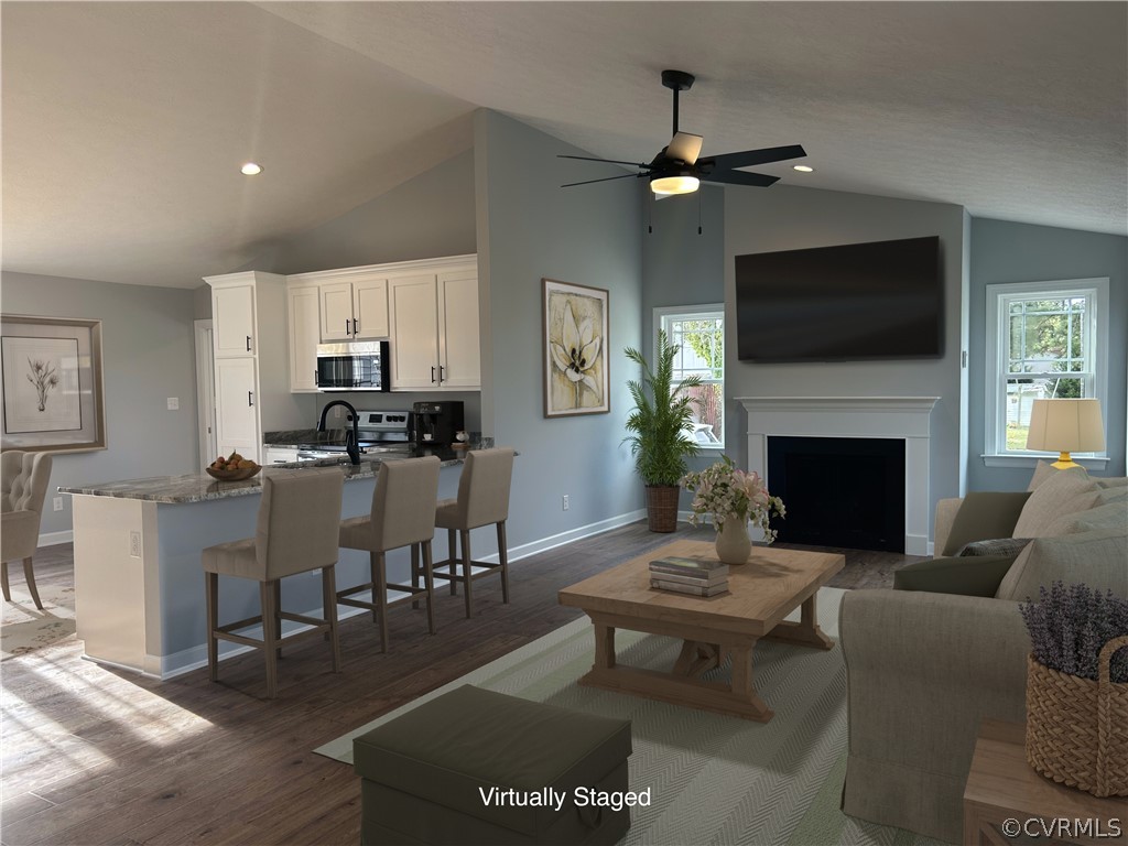 2029 Churchville Road West Point, VA 23181 - Photo 3 of 17 a living room with furniture a flat screen tv and a fireplace
