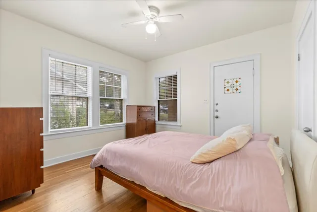 a bedroom with a large bed and a large window