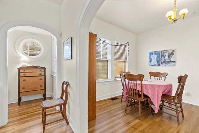 a view of a dining room with furniture window and wooden floor