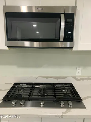 a kitchen with white cabinets