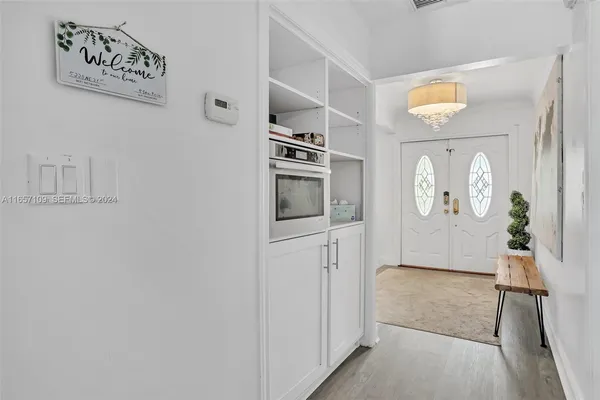 a view of a kitchen from the hallway