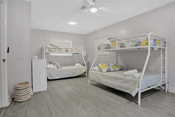 a bedroom with a bed and a chair