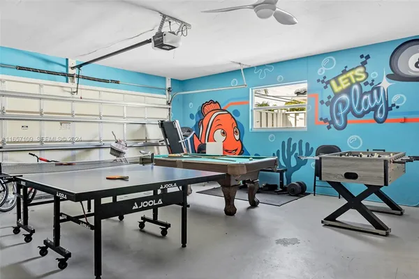 a view of a room with furniture and air hockey table
