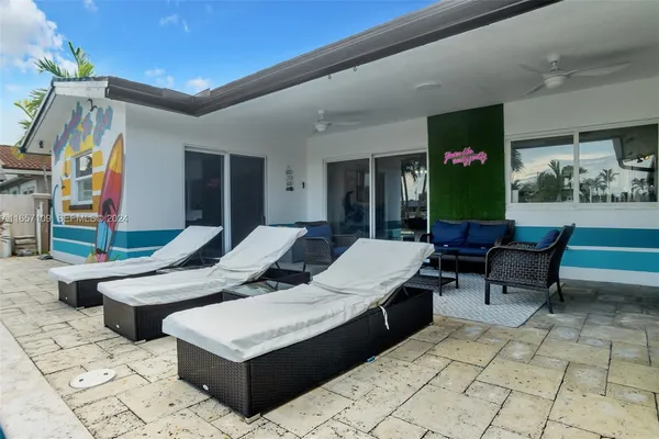 a view of a swimming pool with a lounge chairs