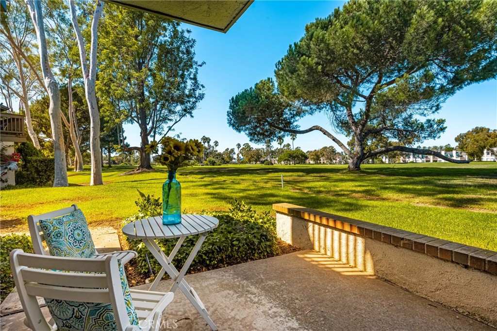 a view of a swimming pool with an outdoor seating