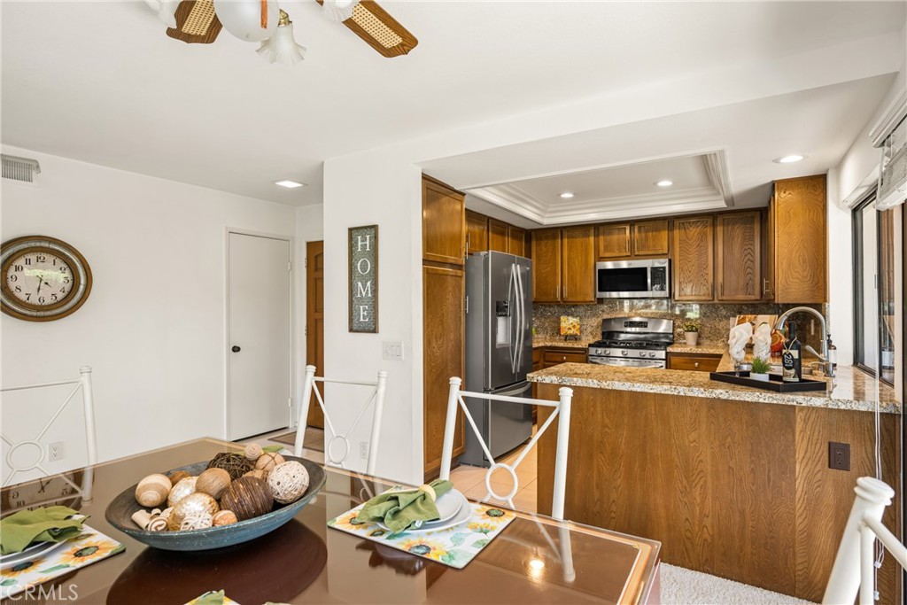 18 Solana Irvine, CA 92612 - Photo 18 of 55 a kitchen with stainless steel appliances kitchen island granite countertop a sink and cabinets