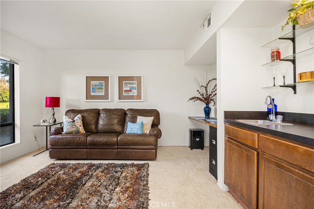 18 Solana Irvine, CA 92612 - Photo 29 of 55 a living room with furniture and a potted plant
