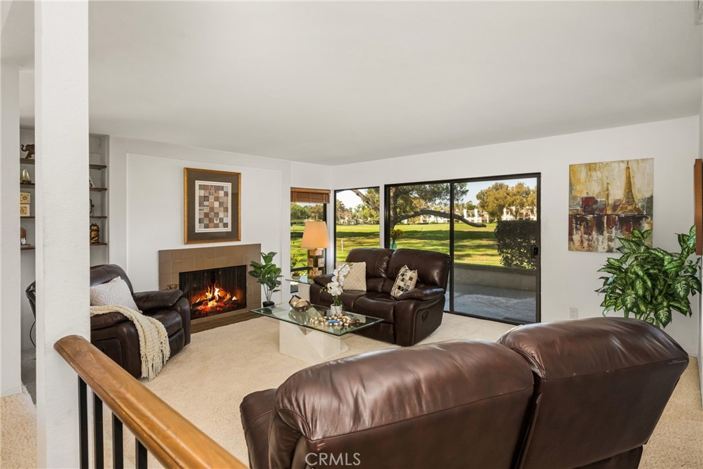 18 Solana Irvine, CA 92612 - Photo 3 of 55 a living room with furniture and a fireplace
