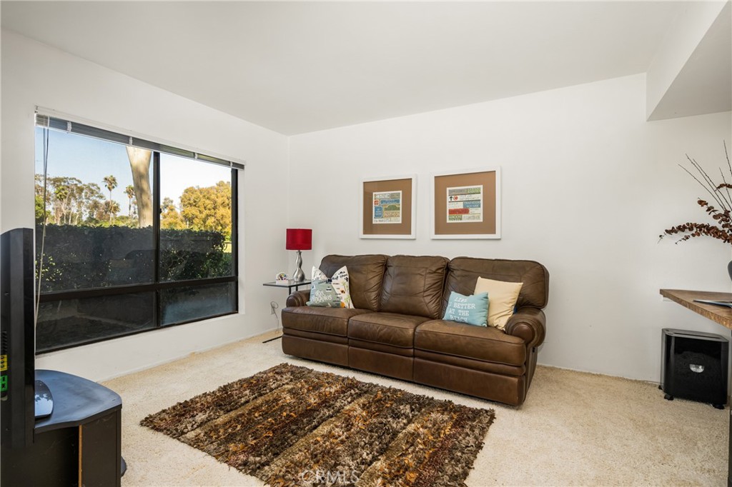 18 Solana Irvine, CA 92612 - Photo 30 of 55 a living room with a couch and a fireplace