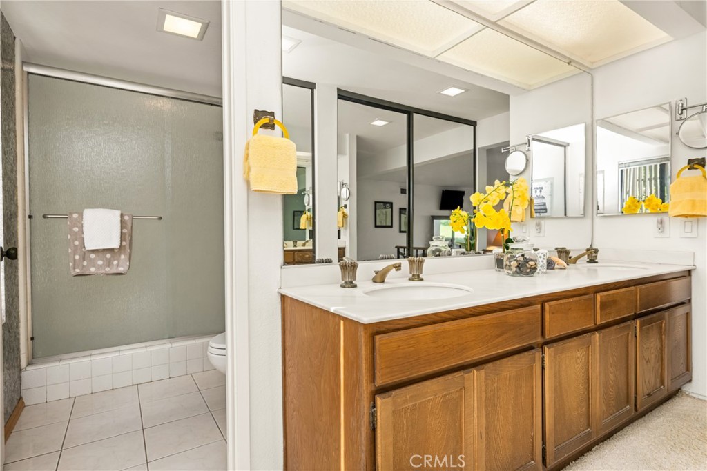 18 Solana Irvine, CA 92612 - Photo 38 of 55 a bathroom with a sink and a mirror