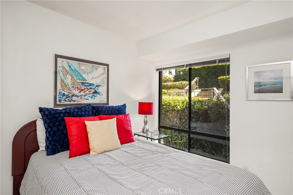18 Solana Irvine, CA 92612 - Photo 41 of 55 a bedroom with a bed and a painting on the wall