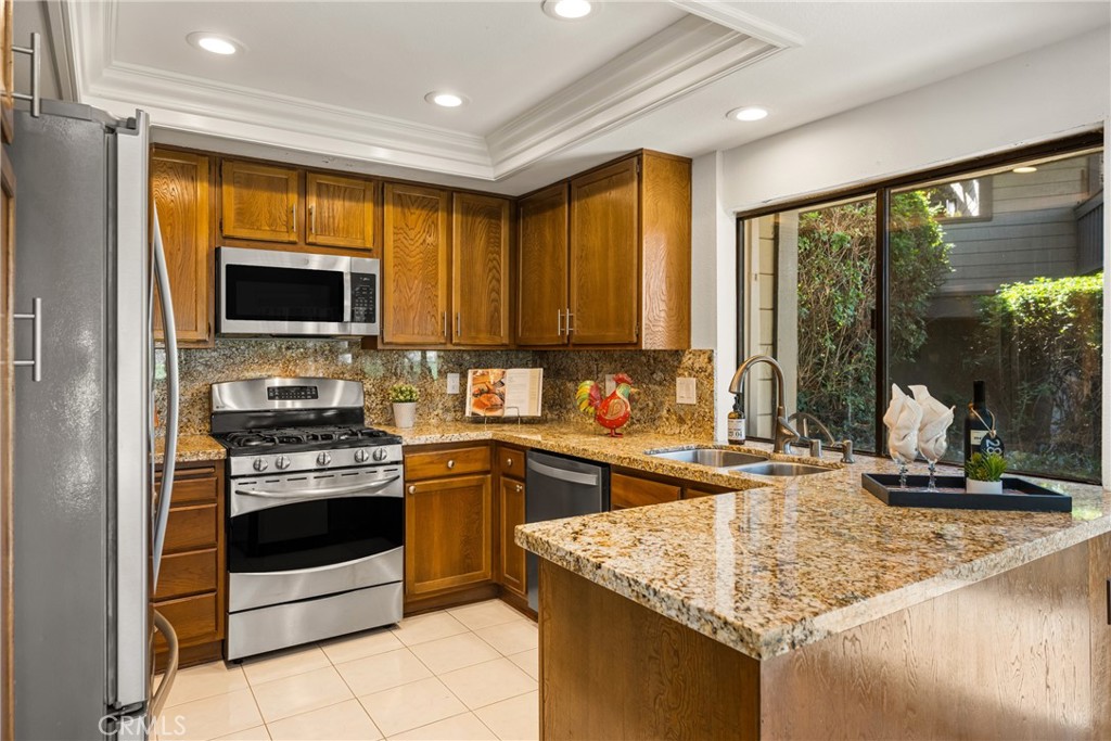 18 Solana Irvine, CA 92612 - Photo 5 of 55 a kitchen with a stove sink and microwave