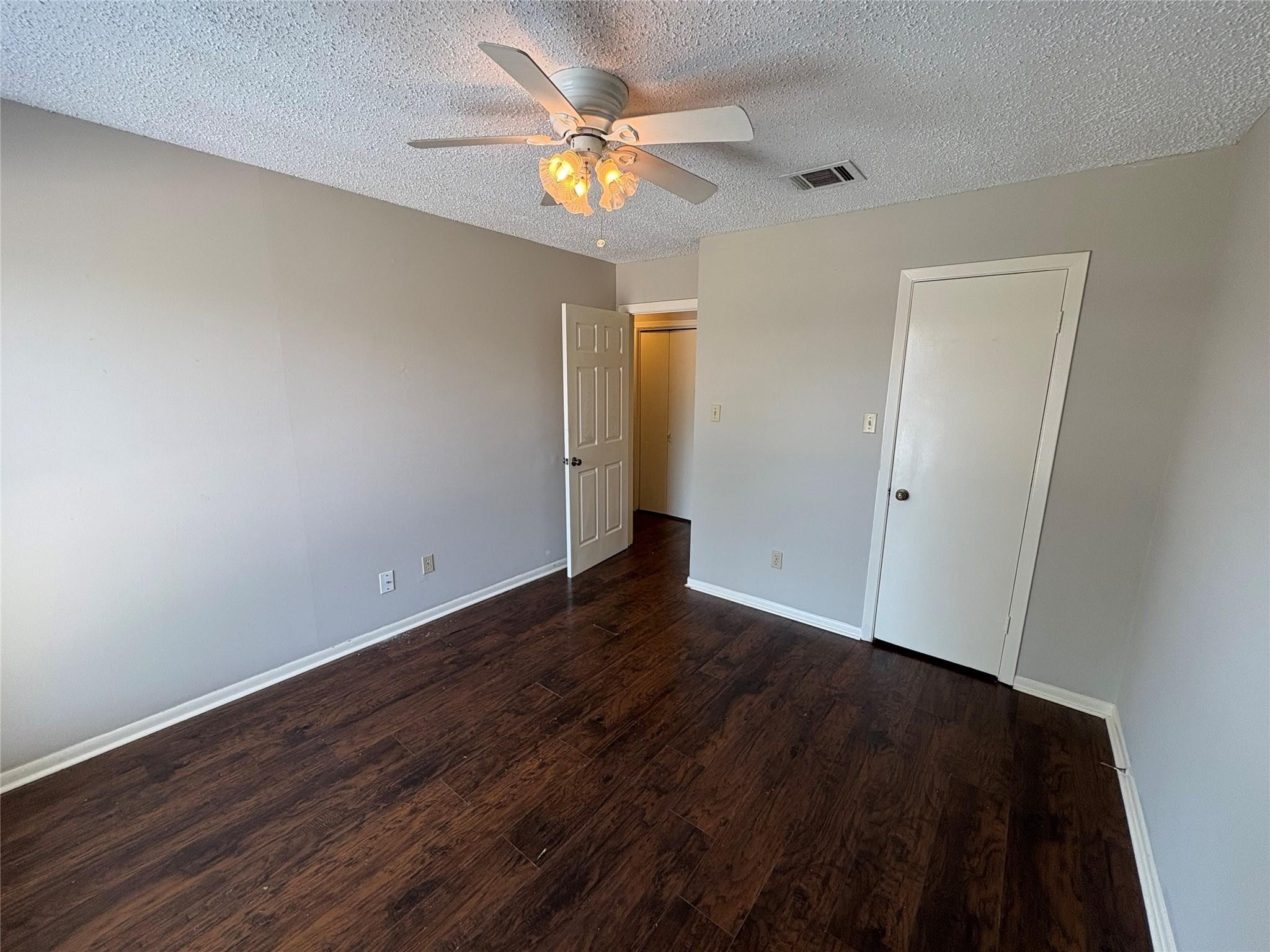 17159 Beaver Springs Drive, Unit 13 Houston, TX 77090 - Photo 11 of 14 wooden floor in an empty room