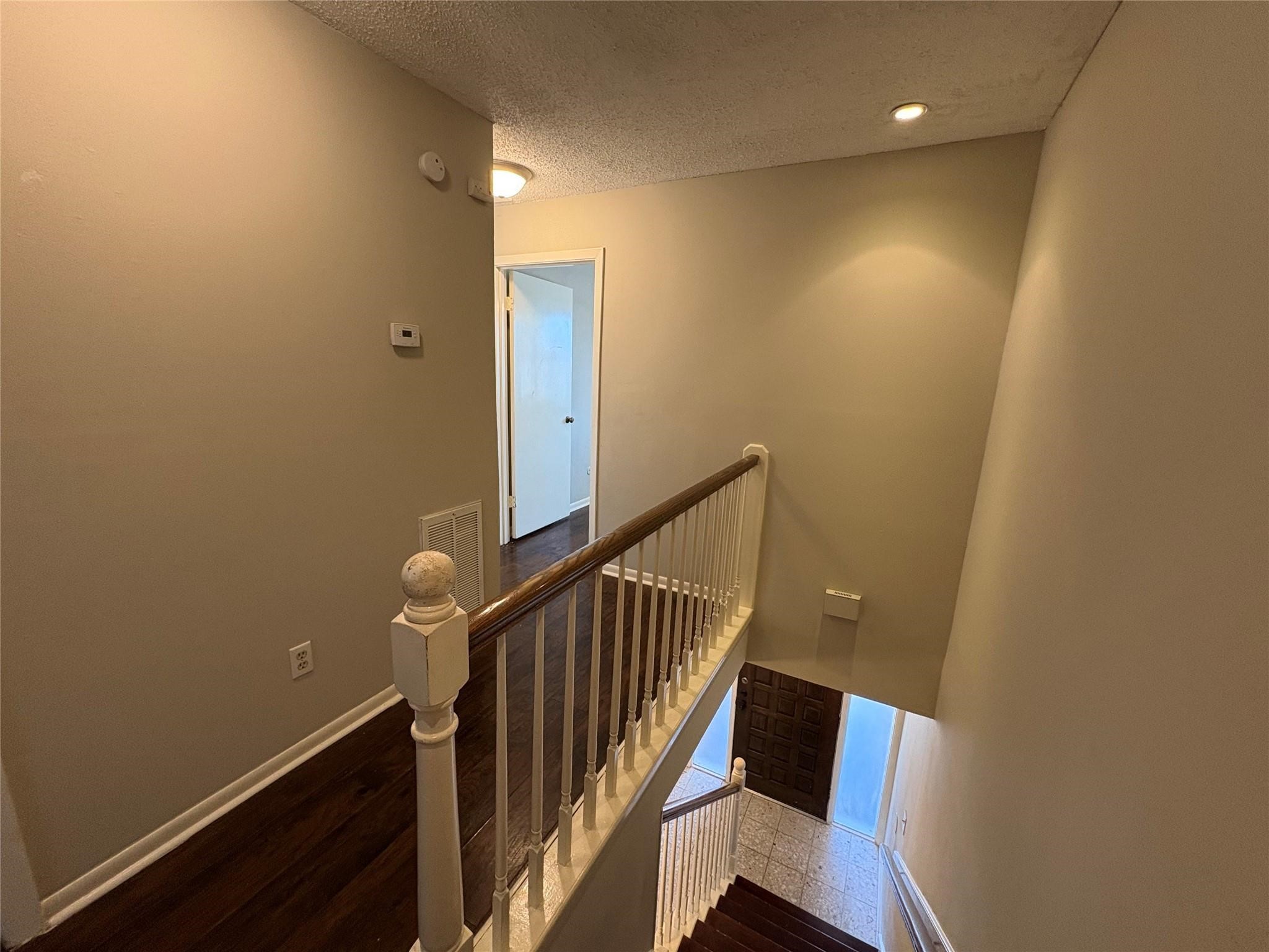 17159 Beaver Springs Drive, Unit 13 Houston, TX 77090 - Photo 7 of 14 a view of a hallway with staircase