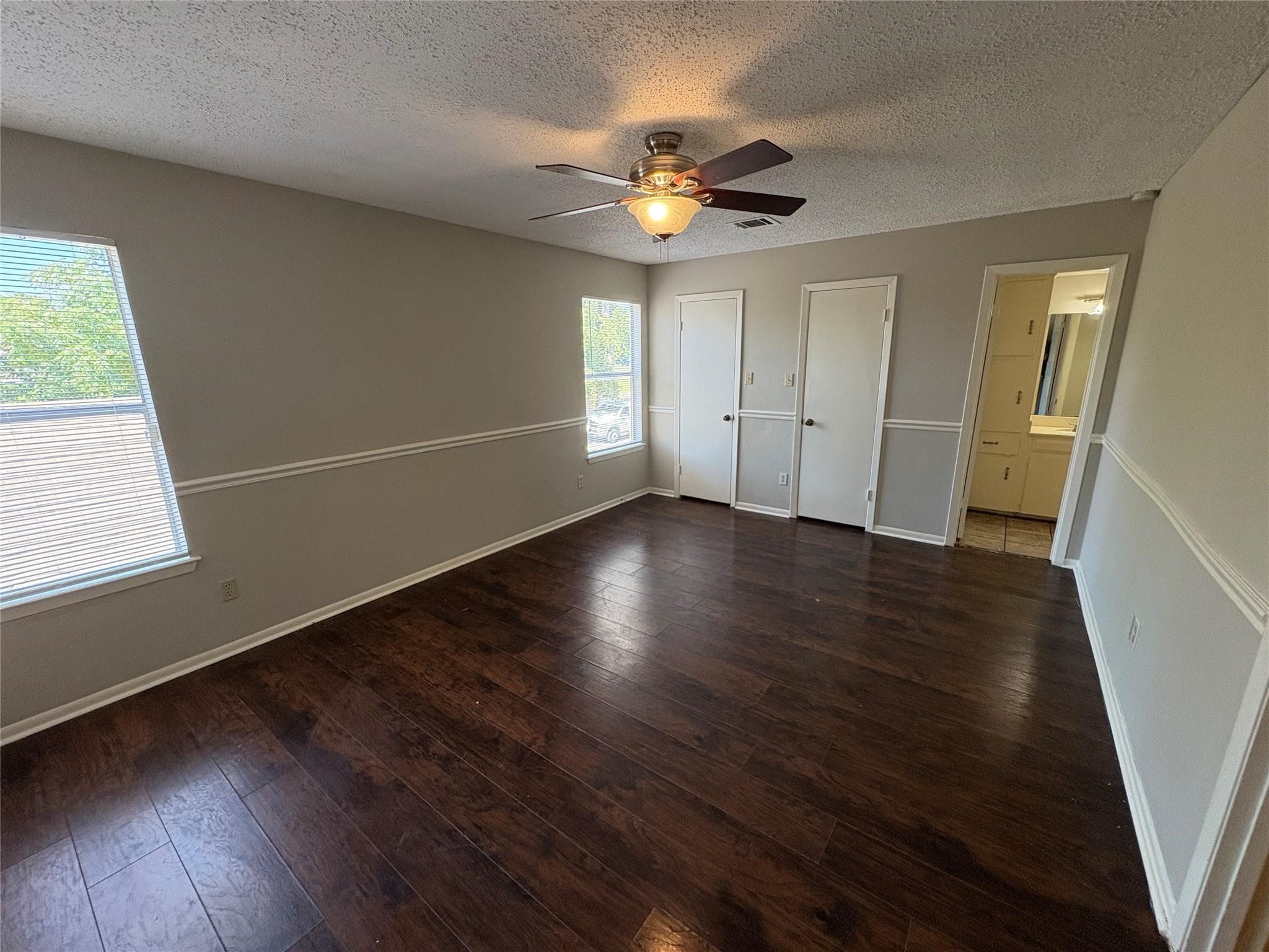 17159 Beaver Springs Drive, Unit 13 Houston, TX 77090 - Photo 8 of 14 a view of wooden floor and windows in a room