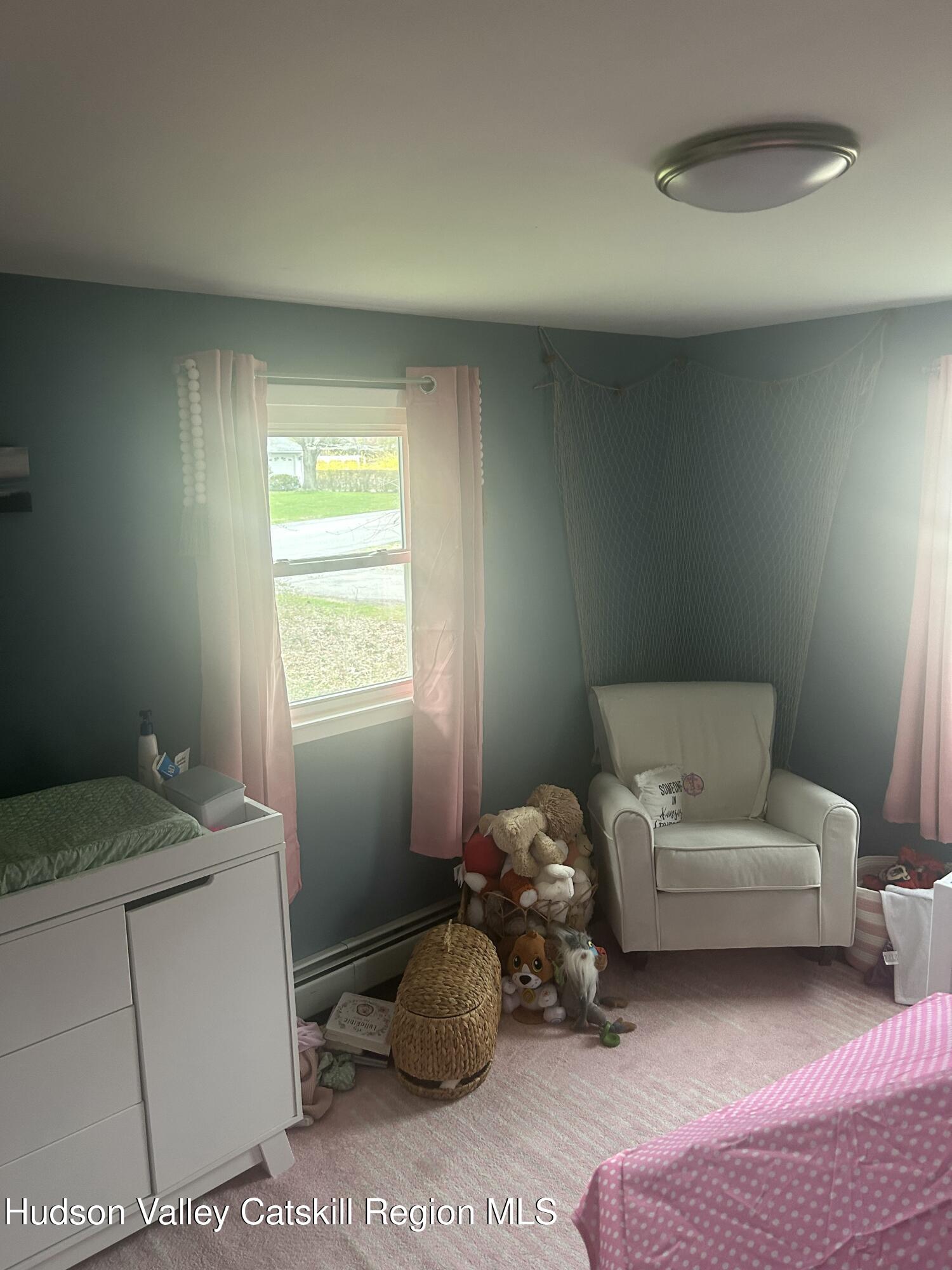 22 Caywood Road Poughkeepsie, NY 12603 - Photo 17 of 27 a bedroom with a bed and a window